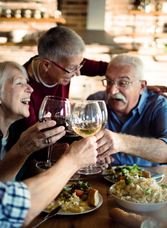 seniors with wine glasses