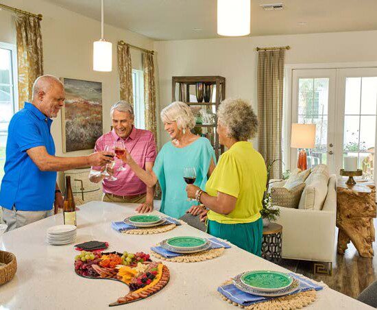 Seniors with wine in the kitchen