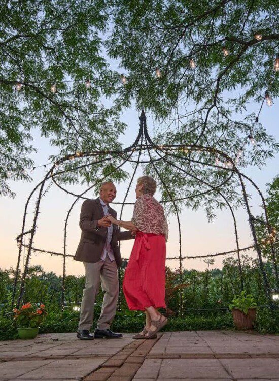 older-couple-dancing-garden